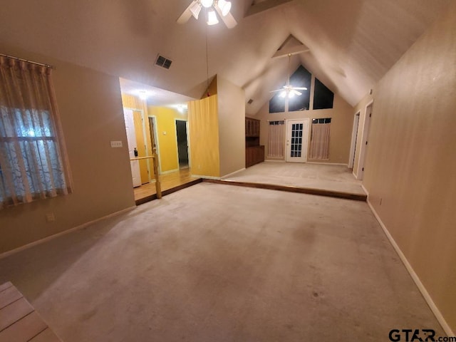 additional living space with ceiling fan, light carpet, and vaulted ceiling