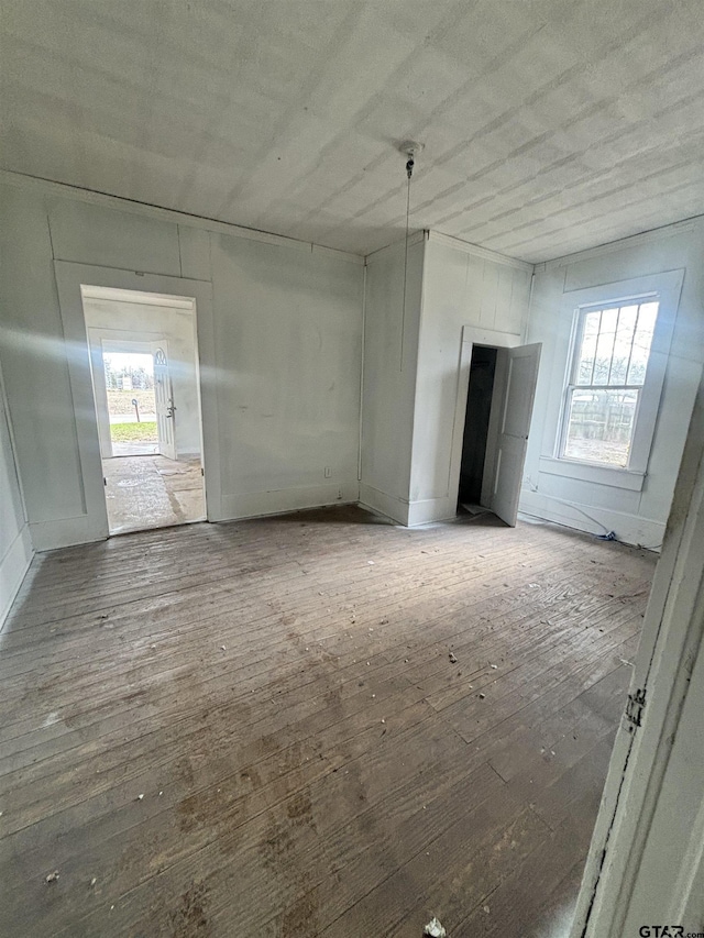 empty room featuring wood-type flooring