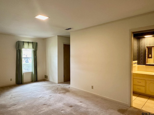 carpeted spare room with ornamental molding