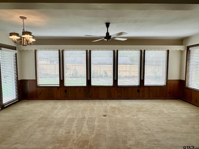 empty room with light carpet and a wealth of natural light