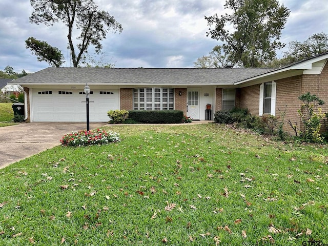 single story home featuring a front yard and a garage