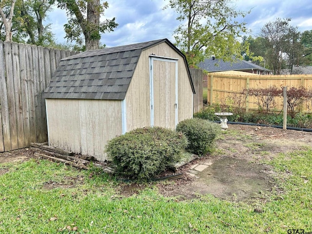 view of shed with a fenced backyard