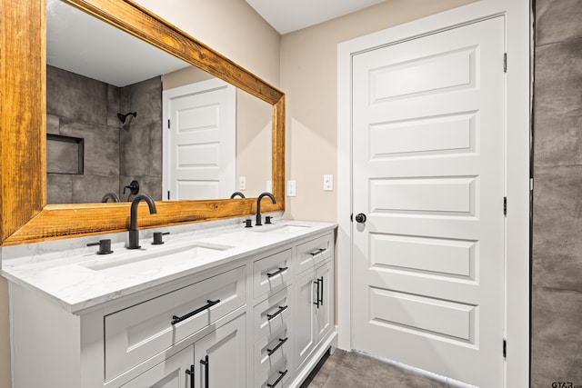 bathroom featuring vanity and concrete floors