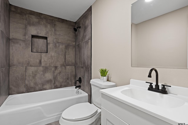 full bathroom with vanity, toilet, and tiled shower / bath combo