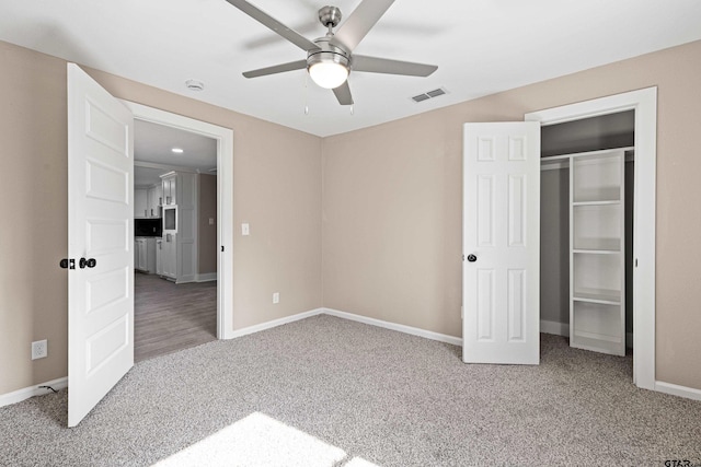 unfurnished bedroom featuring carpet floors and ceiling fan