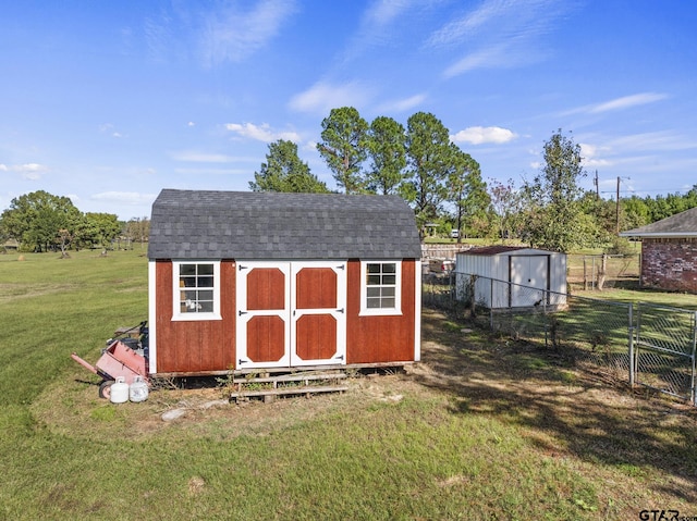 view of outdoor structure featuring a yard