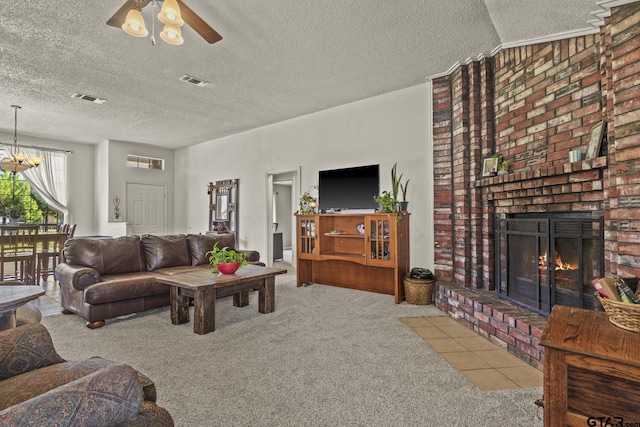 carpeted living room with a brick fireplace, vaulted ceiling, a textured ceiling, and ceiling fan