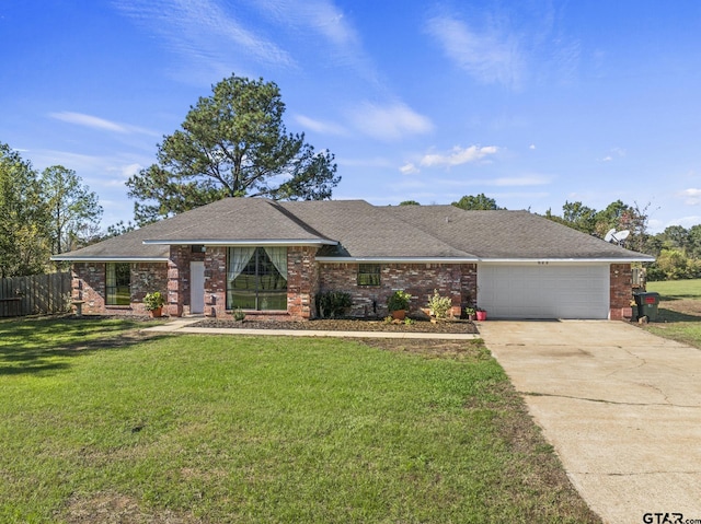 ranch-style house featuring a garage and a front lawn