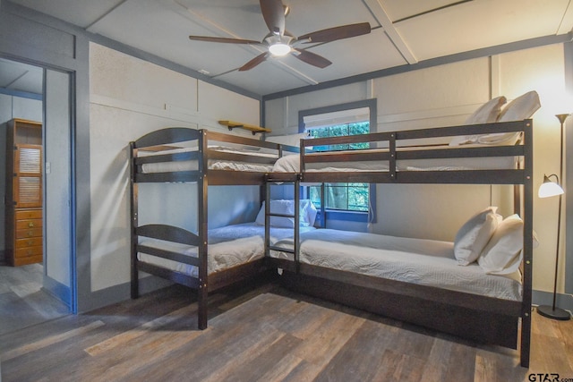 bedroom with ceiling fan and hardwood / wood-style flooring