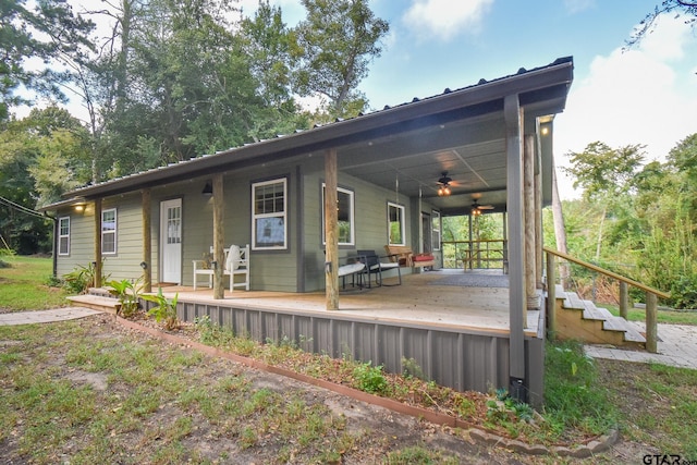 exterior space with covered porch and ceiling fan