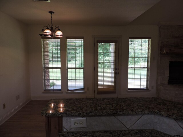 525 Peach Tree Rd, Gun Barrel City, TX 75156 - unfurnished dining area featuring a chandelier and wood finished floors