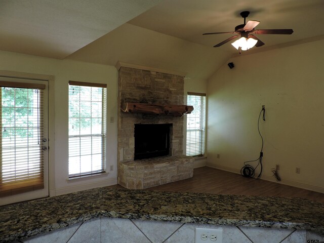 525 Peach Tree Rd, Gun Barrel City, TX 75156 - unfurnished living room with wood finished floors, a fireplace, a ceiling fan, and lofted ceiling