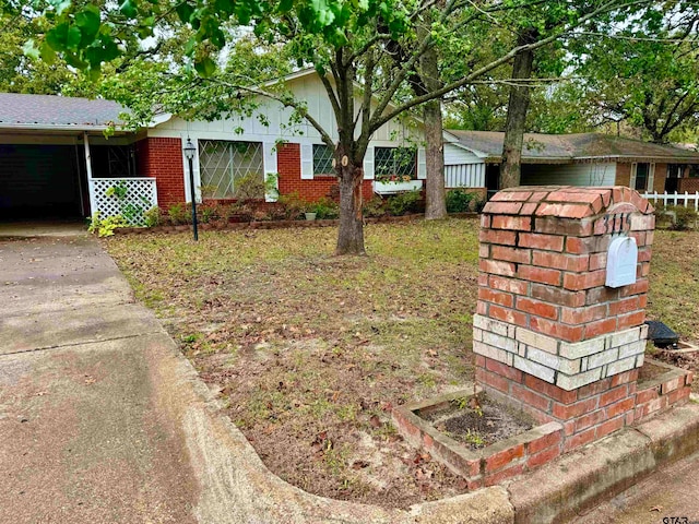 view of front of property featuring a carport