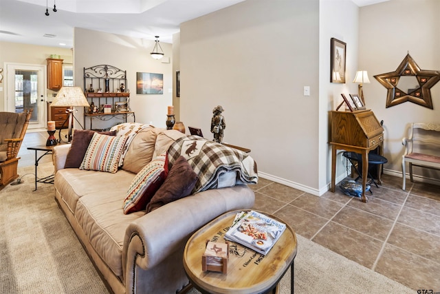 living area with tile patterned floors and baseboards