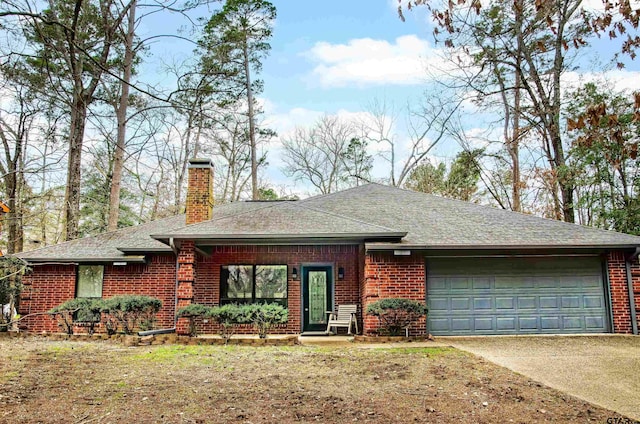 single story home featuring a garage, brick siding, concrete driveway, and a chimney