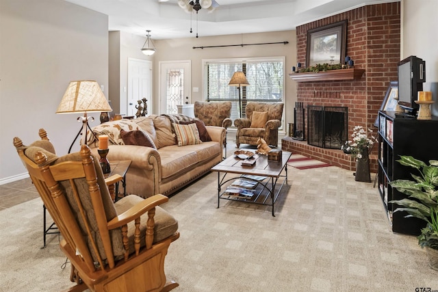 living room with tile patterned flooring, a fireplace, baseboards, and ceiling fan