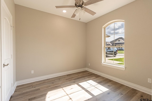 unfurnished room featuring wood-type flooring and ceiling fan