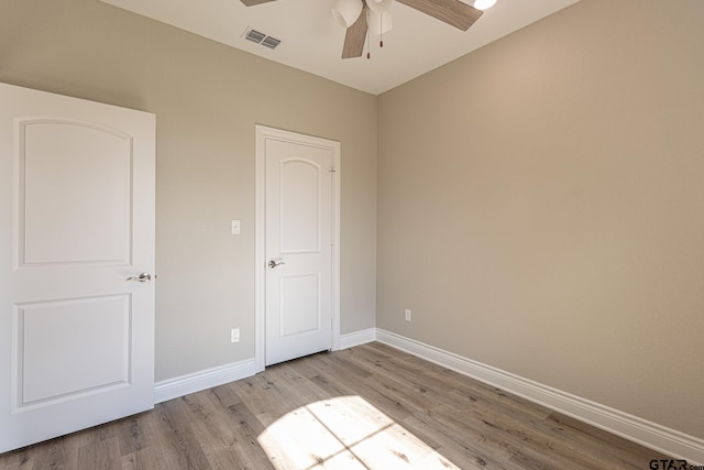 unfurnished bedroom with light hardwood / wood-style flooring and ceiling fan