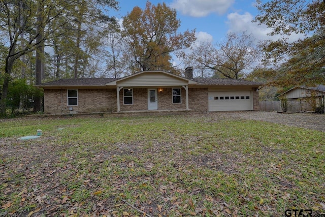 ranch-style house with a garage and a front lawn