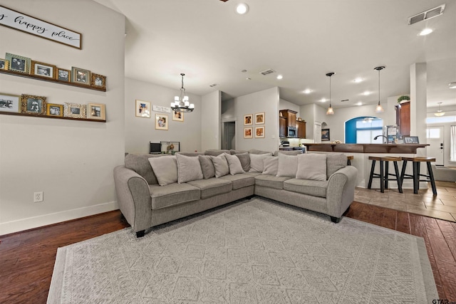 10926 Westhaven Cir, Flint, TX 75762 - living area featuring wood finished floors, a chandelier, recessed lighting, and arched walkways