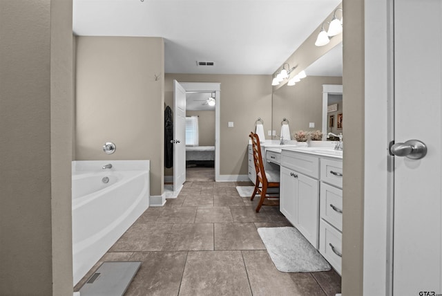 10926 Westhaven Cir, Flint, TX 75762 - bathroom featuring double vanity, a bath, ceiling fan, tile patterned flooring, and connected bathroom