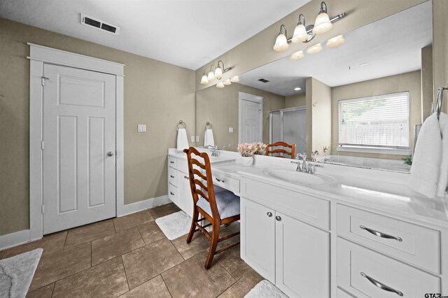 10926 Westhaven Cir, Flint, TX 75762 - full bath with double vanity, an enclosed shower, and tile patterned flooring
