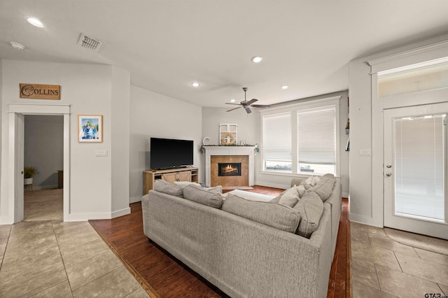 10926 Westhaven Cir, Flint, TX 75762 - tiled living area with a ceiling fan, a tile fireplace, and recessed lighting