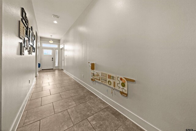 10926 Westhaven Cir, Flint, TX 75762 - corridor featuring baseboards and tile patterned floors