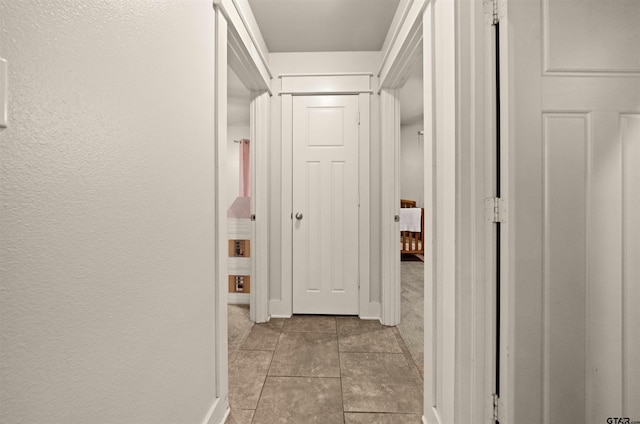 10926 Westhaven Cir, Flint, TX 75762 - hallway featuring baseboards and tile patterned floors