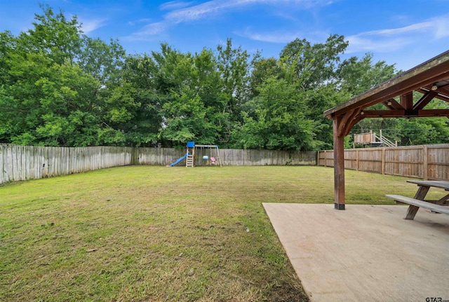 10926 Westhaven Cir, Flint, TX 75762 - fenced backyard with a playground and a patio