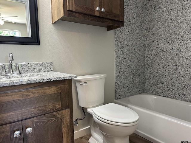 full bath featuring wood finished floors, vanity, toilet, and a ceiling fan