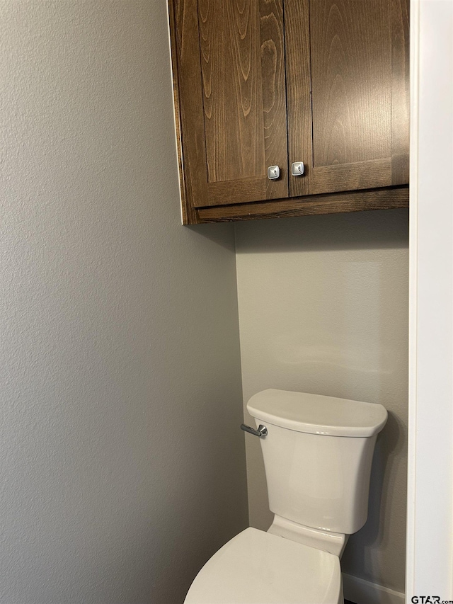 bathroom featuring toilet