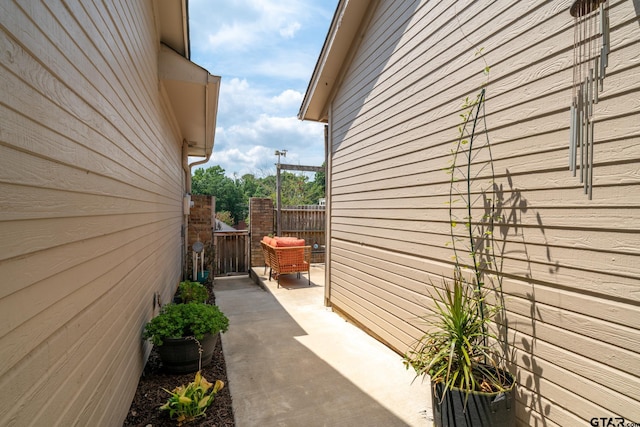 view of side of home with a patio area