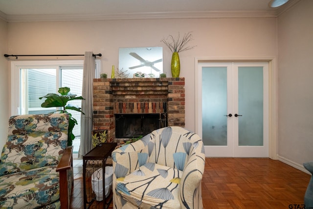 sitting room featuring crown molding, french doors, parquet floors, and a brick fireplace