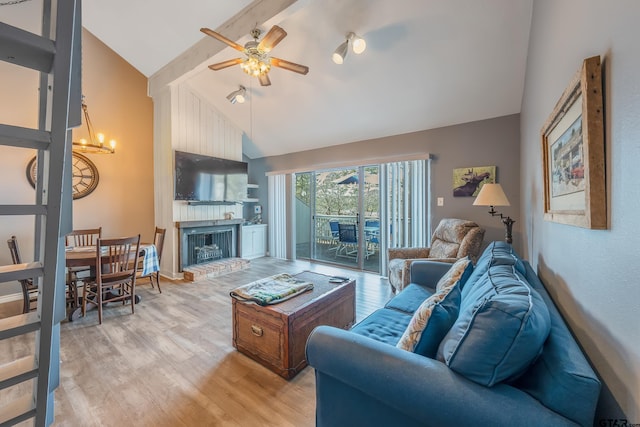 living room with ceiling fan, a fireplace, beam ceiling, light wood-type flooring, and high vaulted ceiling