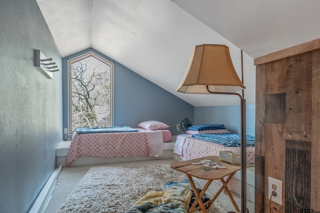 bedroom with a textured ceiling and lofted ceiling