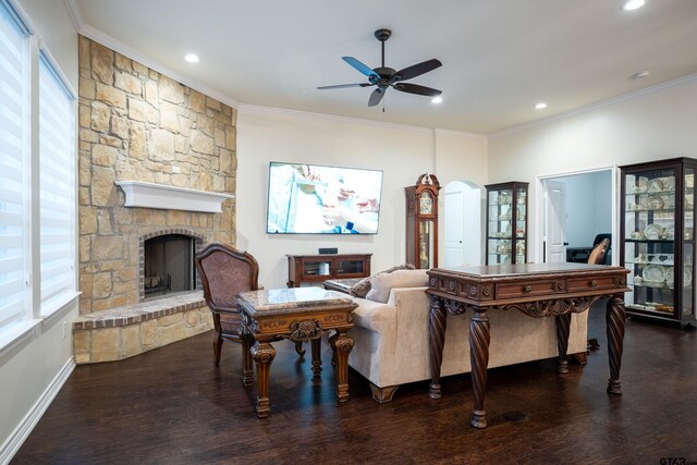 living room with dark hardwood / wood-style floors, an inviting chandelier, a wealth of natural light, and crown molding