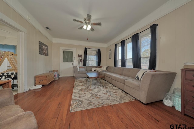 living room featuring ceiling fan and hardwood / wood-style floors