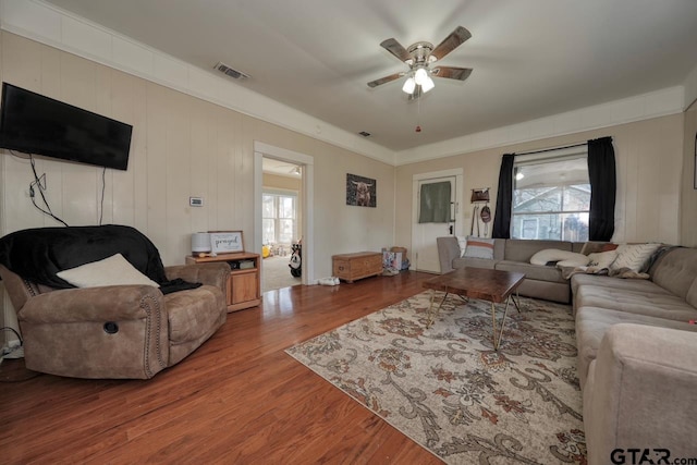 living room featuring a healthy amount of sunlight, hardwood / wood-style flooring, and ceiling fan