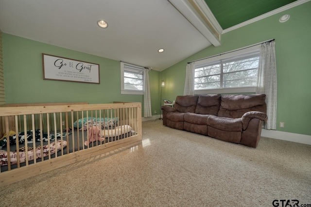 bedroom with lofted ceiling with beams and ornamental molding