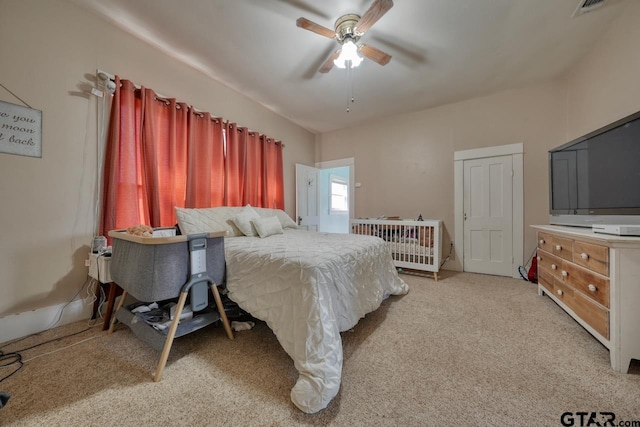 bedroom with light carpet and ceiling fan