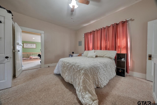 bedroom with ceiling fan and light colored carpet