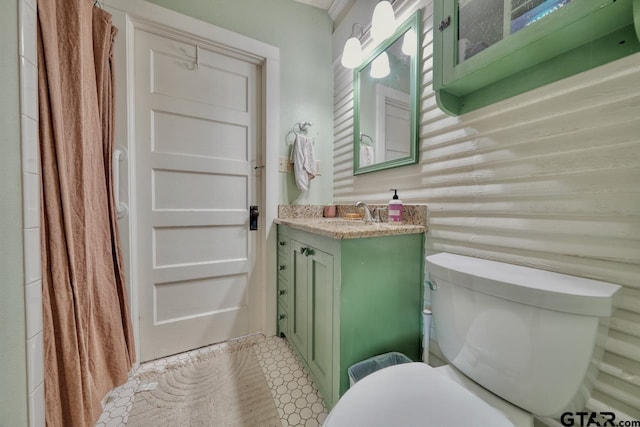 bathroom featuring toilet and vanity