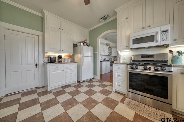 kitchen featuring ornamental molding, white appliances, white cabinetry, and backsplash