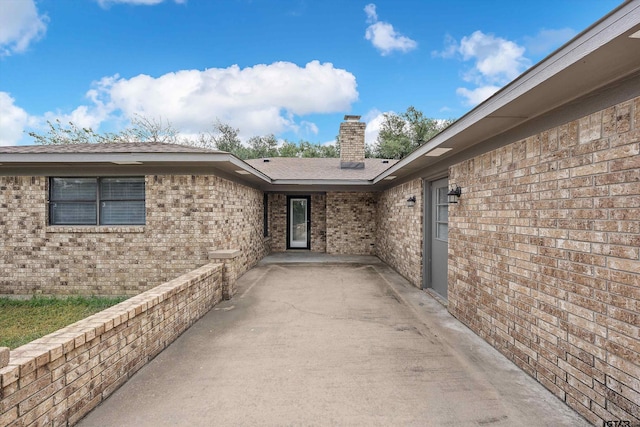 doorway to property featuring a patio area