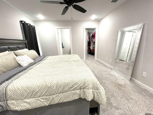 bedroom with carpet, visible vents, a spacious closet, and baseboards