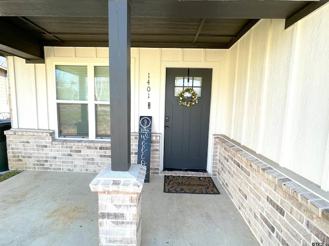 entrance to property with brick siding