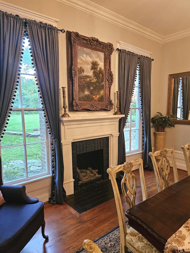 301 W Larissa, Jacksonville, TX 75766 - living area with wood finished floors, crown molding, plenty of natural light, and a brick fireplace
