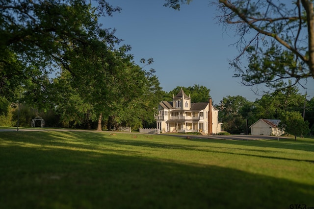 301 W Larissa, Jacksonville, TX 75766 - view of property's community with a yard