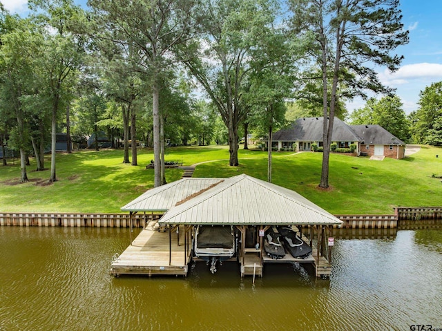 dock area with a water view, a yard, and boat lift